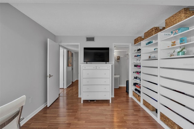 337 Rex Pl Unit E, Madeira Beach, FL 33708 - spacious closet featuring wood finished floors
