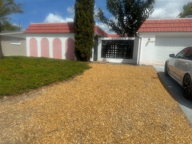 5137 Manor Dr, New Port Richey, FL 34652 - view of yard with a garage
