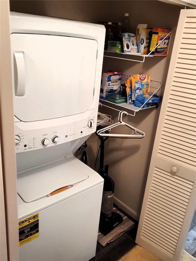 8810 41st St N, Pinellas Park, FL 33782 - washroom with stacked washing machine and dryer and tile patterned flooring