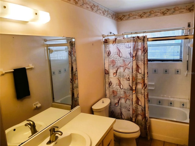 8810 41st St N, Pinellas Park, FL 33782 - bathroom featuring shower / bath combo with shower curtain, vanity, and tile patterned floors