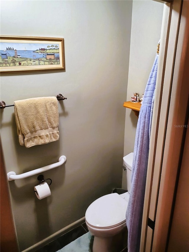 8810 41st St N, Pinellas Park, FL 33782 - bathroom featuring toilet and tile patterned flooring