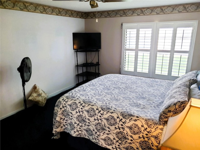 8810 41st St N, Pinellas Park, FL 33782 - bedroom with baseboards and a ceiling fan