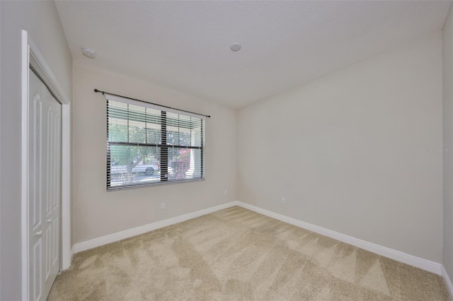 838 Vino Verde Cir, Brandon, FL 33511 - unfurnished bedroom with a closet, baseboards, and light colored carpet