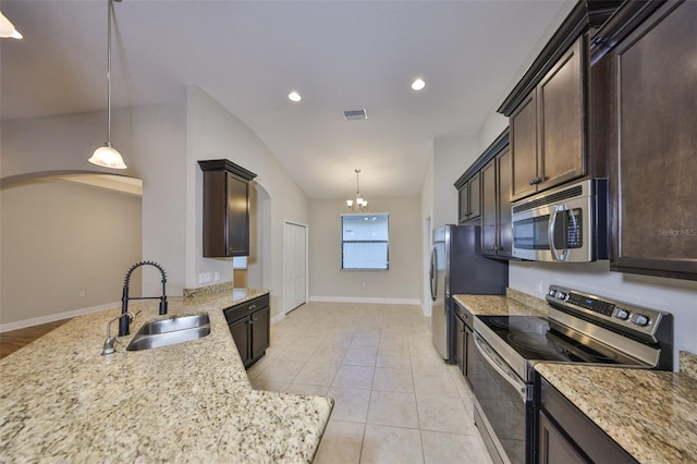 838 Vino Verde Cir, Brandon, FL 33511 - kitchen featuring arched walkways, appliances with stainless steel finishes, a sink, and visible vents