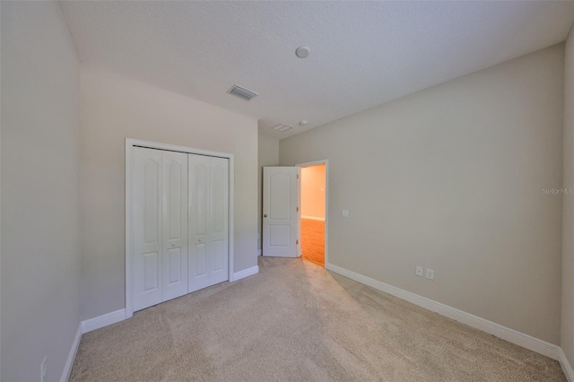 838 Vino Verde Cir, Brandon, FL 33511 - unfurnished bedroom with a closet, carpet, visible vents, and baseboards