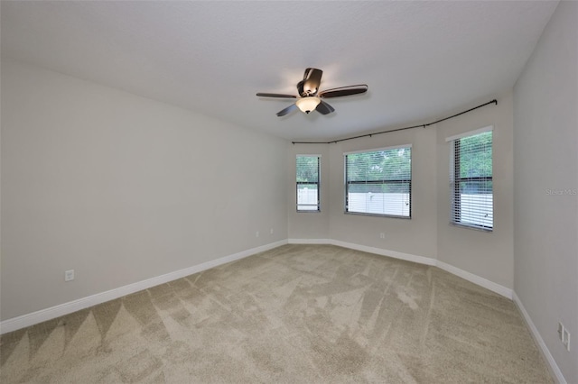838 Vino Verde Cir, Brandon, FL 33511 - spare room featuring light carpet, baseboards, and a ceiling fan