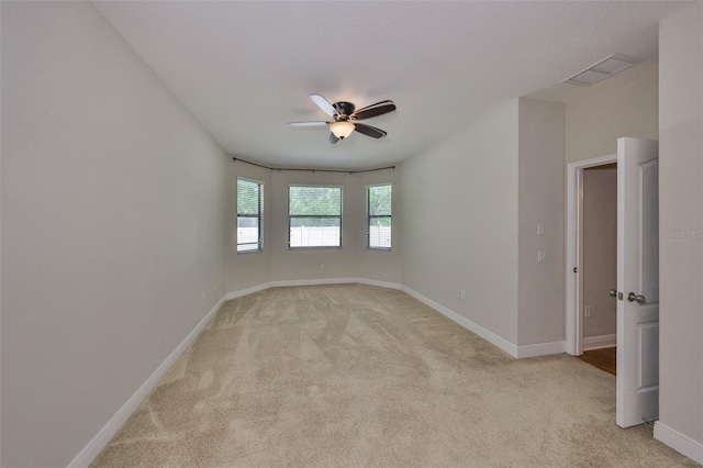 838 Vino Verde Cir, Brandon, FL 33511 - spare room with light carpet, baseboards, a ceiling fan, and visible vents