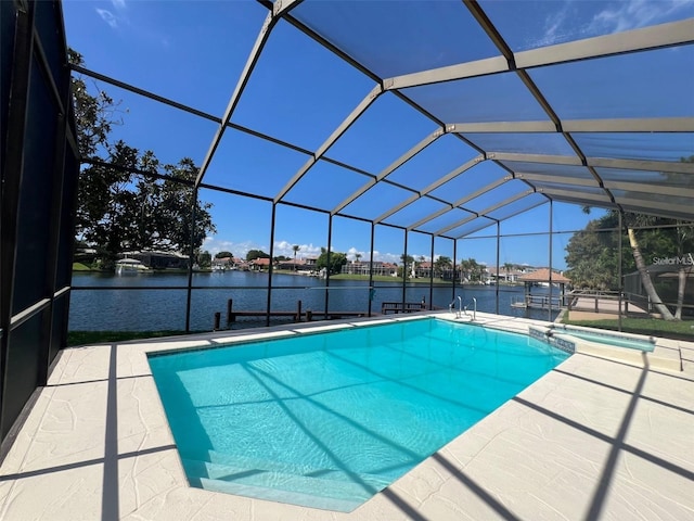 4804 Longwater Way, Tampa, FL 33615 - view of pool with a water view, a patio area, a pool with connected hot tub, glass enclosure, and a dock