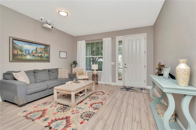 3408 W Bay Ave, Tampa, FL 33611 - living area featuring baseboards and light wood-type flooring