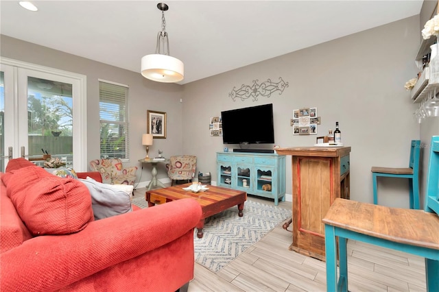 3408 W Bay Ave, Tampa, FL 33611 - living room with baseboards and light wood-style floors