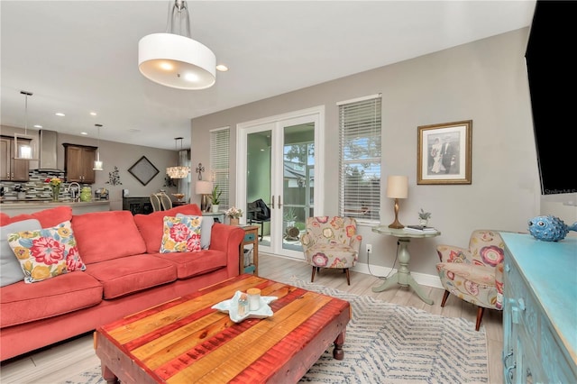 3408 W Bay Ave, Tampa, FL 33611 - living room featuring french doors, light wood-type flooring, recessed lighting, and baseboards