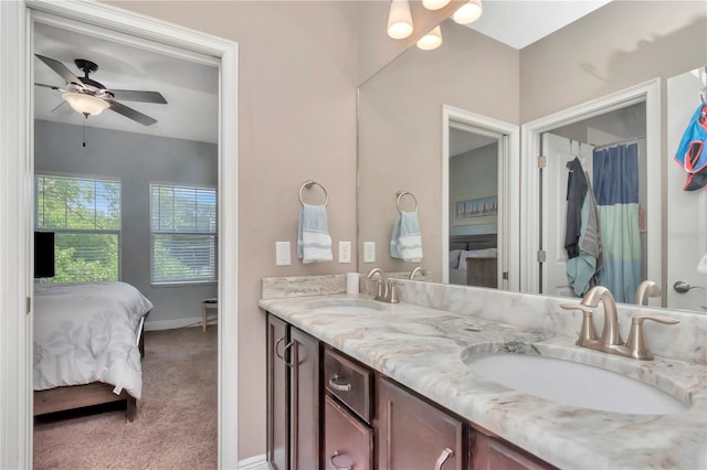 3408 W Bay Ave, Tampa, FL 33611 - ensuite bathroom featuring double vanity, ceiling fan, ensuite bath, and a sink