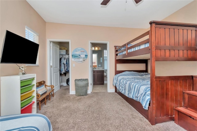 3408 W Bay Ave, Tampa, FL 33611 - carpeted bedroom featuring ceiling fan, ensuite bathroom, a closet, and a walk in closet