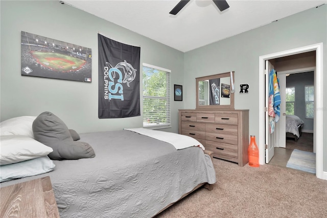 3408 W Bay Ave, Tampa, FL 33611 - carpeted bedroom with a ceiling fan and multiple windows
