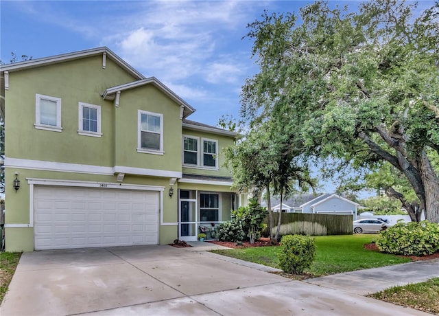 3408 W Bay Ave, Tampa, FL 33611 - traditional-style house featuring stucco siding, fence, driveway, and an attached garage