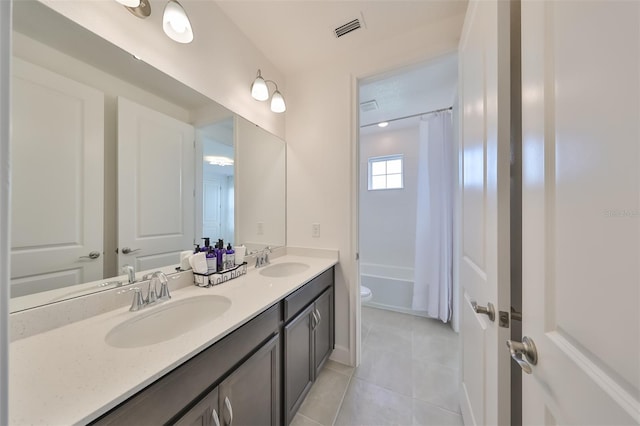 full bathroom with visible vents, a sink, tile patterned flooring, and double vanity