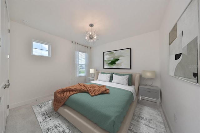 bedroom featuring baseboards and light colored carpet