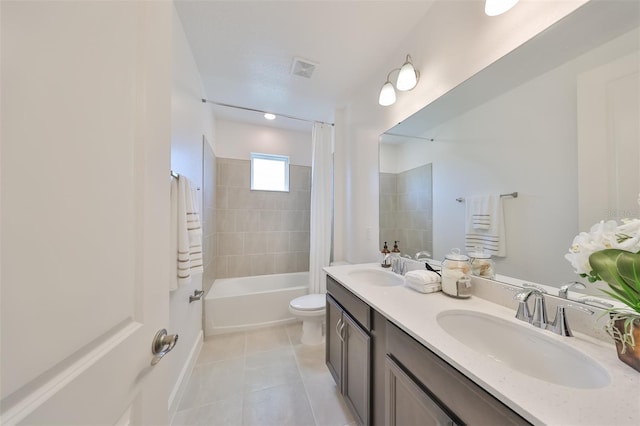 bathroom with tile patterned floors, toilet, a sink, and shower / bathtub combination with curtain
