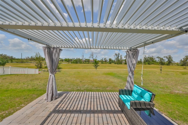 wooden terrace with a lawn, fence, a pergola, and a patio area