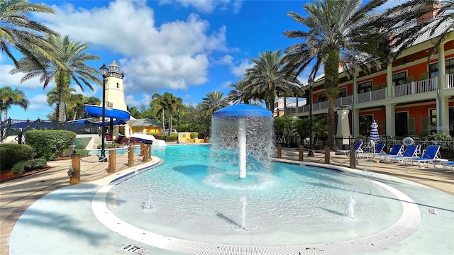 view of pool with a water slide