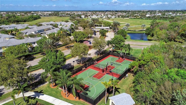 birds eye view of property featuring a water view and a residential view