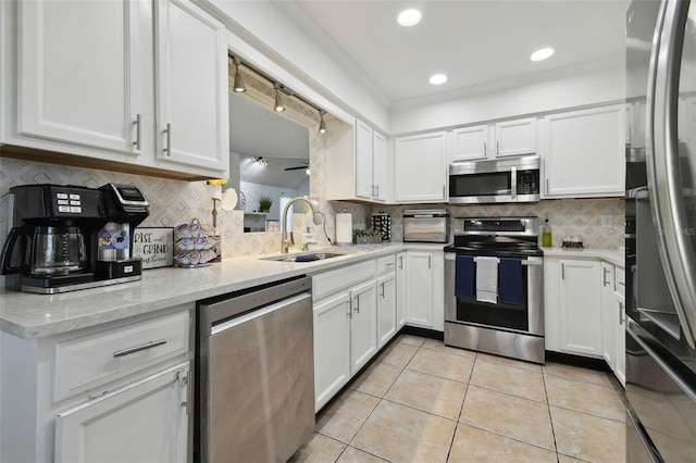 kitchen with white cabinets, appliances with stainless steel finishes, and a sink