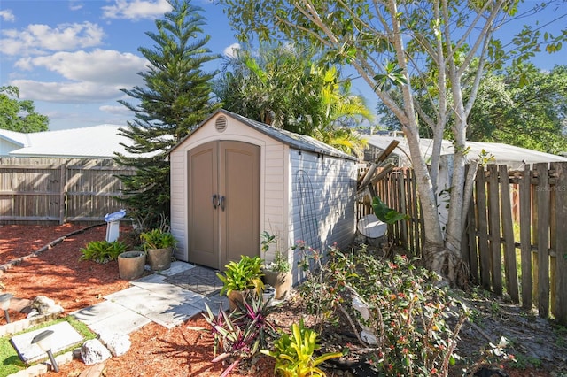 view of shed featuring a fenced backyard