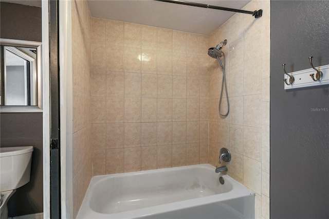 bathroom with shower / washtub combination and toilet