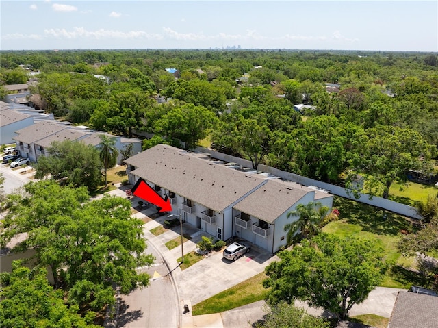 birds eye view of property with a forest view
