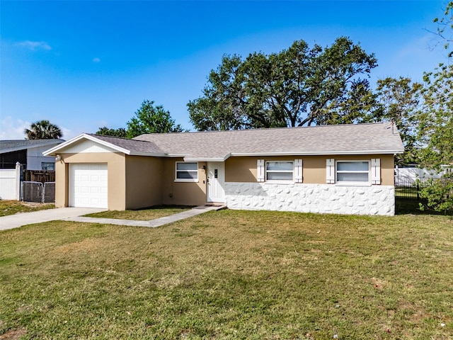 428 Flamingo Dr, Apollo Beach, FL 33572 - ranch-style house with an attached garage, concrete driveway, and stucco siding