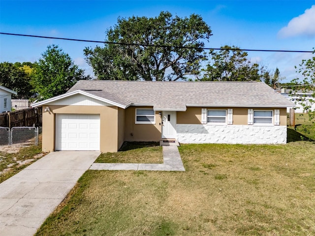 428 Flamingo Dr, Apollo Beach, FL 33572 - single story home with an attached garage, stucco siding, driveway, and roof with shingles