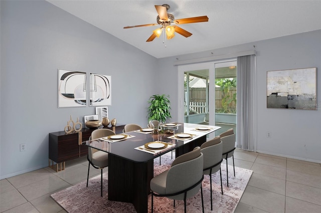 5814 Silver Moon Ave, Tampa, FL 33625 - dining area with vaulted ceiling, light tile patterned floors, a ceiling fan, and baseboards