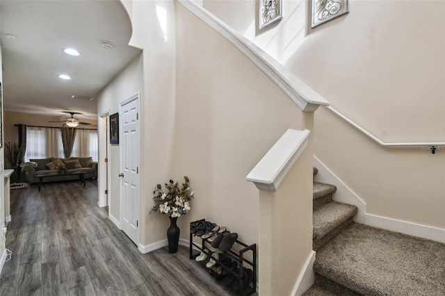 stairway with baseboards, wood finished floors, recessed lighting, and a ceiling fan
