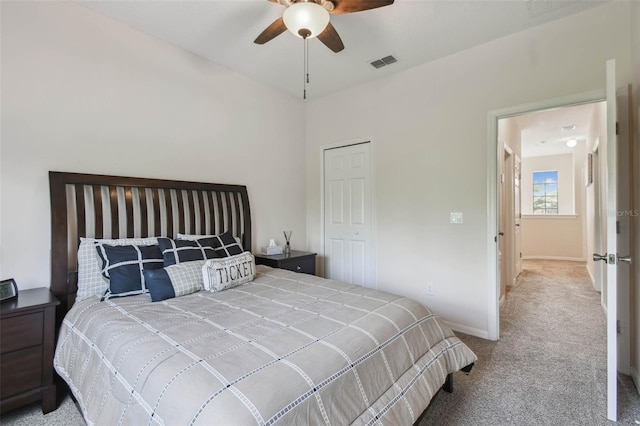 carpeted bedroom featuring baseboards, visible vents, and a ceiling fan