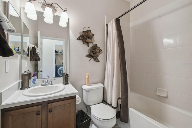 bathroom featuring shower / tub combo, washer / dryer, toilet, and vanity