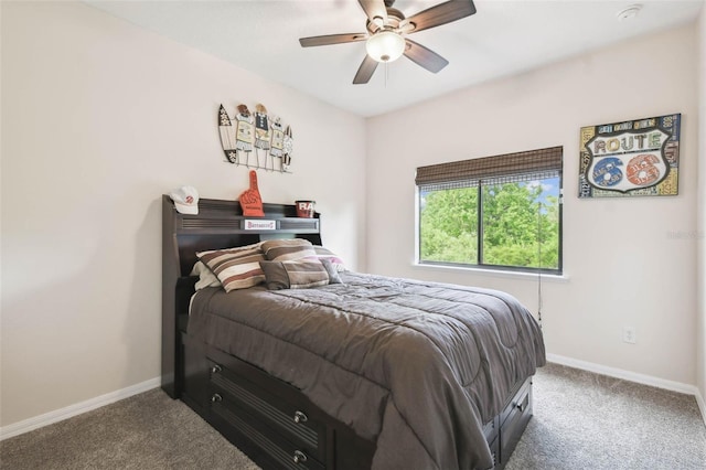 carpeted bedroom with baseboards and a ceiling fan