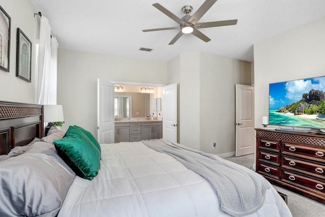10703 Morning Dew Way, Tampa, FL 33647 - carpeted bedroom featuring a ceiling fan, connected bathroom, baseboards, and visible vents