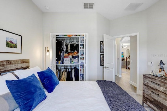 10703 Morning Dew Way, Tampa, FL 33647 - bedroom with a closet, baseboards, arched walkways, and visible vents