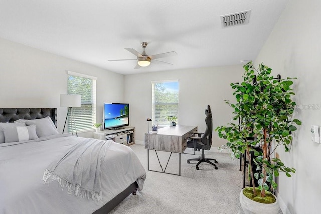 10703 Morning Dew Way, Tampa, FL 33647 - bedroom featuring carpet floors, visible vents, multiple windows, and a ceiling fan