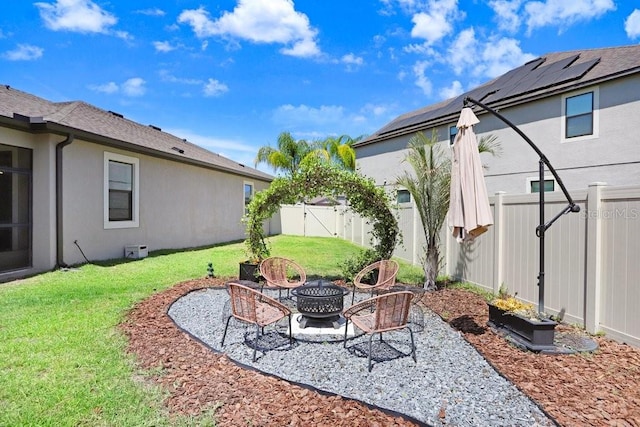 10703 Morning Dew Way, Tampa, FL 33647 - view of yard featuring a fenced backyard, a fire pit, and a patio
