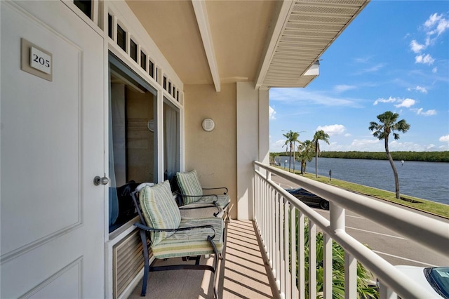 balcony featuring a water view