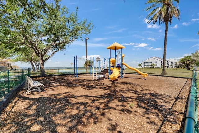 communal playground featuring fence