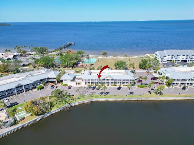 birds eye view of property featuring a water view