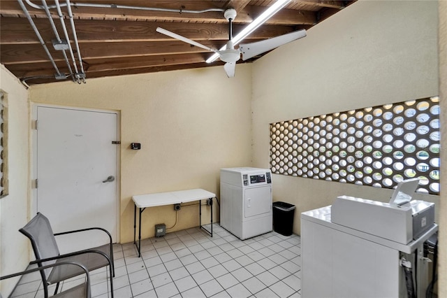 laundry room with light tile patterned floors, washing machine and clothes dryer, and ceiling fan