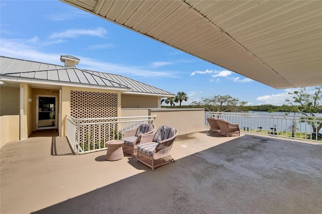 view of patio / terrace featuring a water view