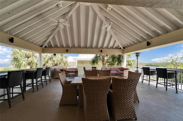 view of patio featuring outdoor dry bar, an outdoor living space, outdoor dining area, ceiling fan, and a gazebo