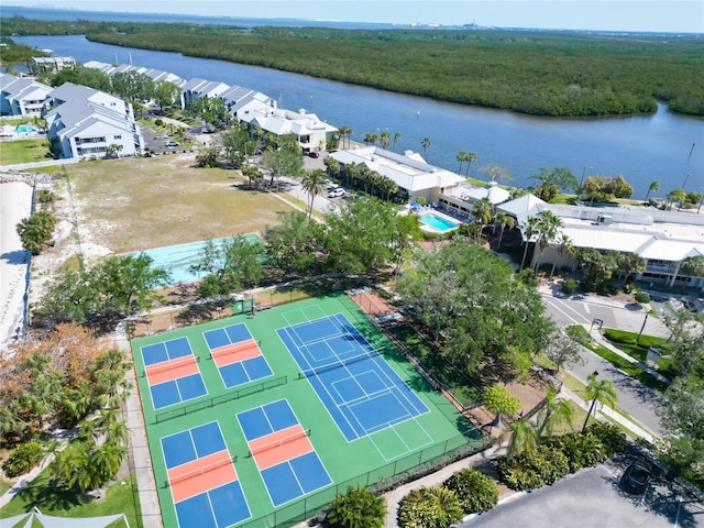 bird's eye view with a water view and a view of trees