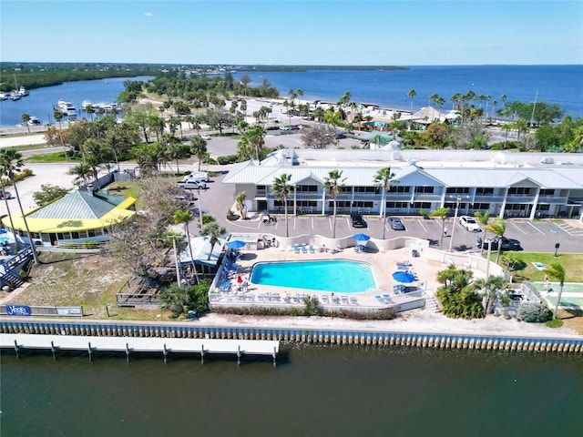 birds eye view of property with a water view