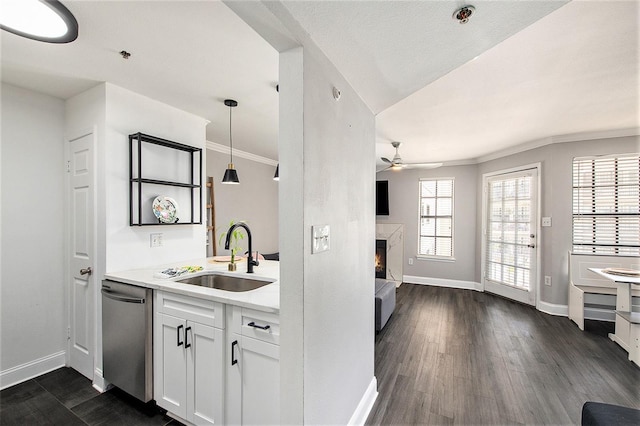 1000 W Horatio St Unit 207, Tampa, FL 33606 - kitchen with dishwasher, baseboards, a sink, and ceiling fan