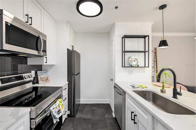 1000 W Horatio St Unit 207, Tampa, FL 33606 - kitchen featuring white cabinets, stainless steel appliances, a sink, baseboards, and light stone counters